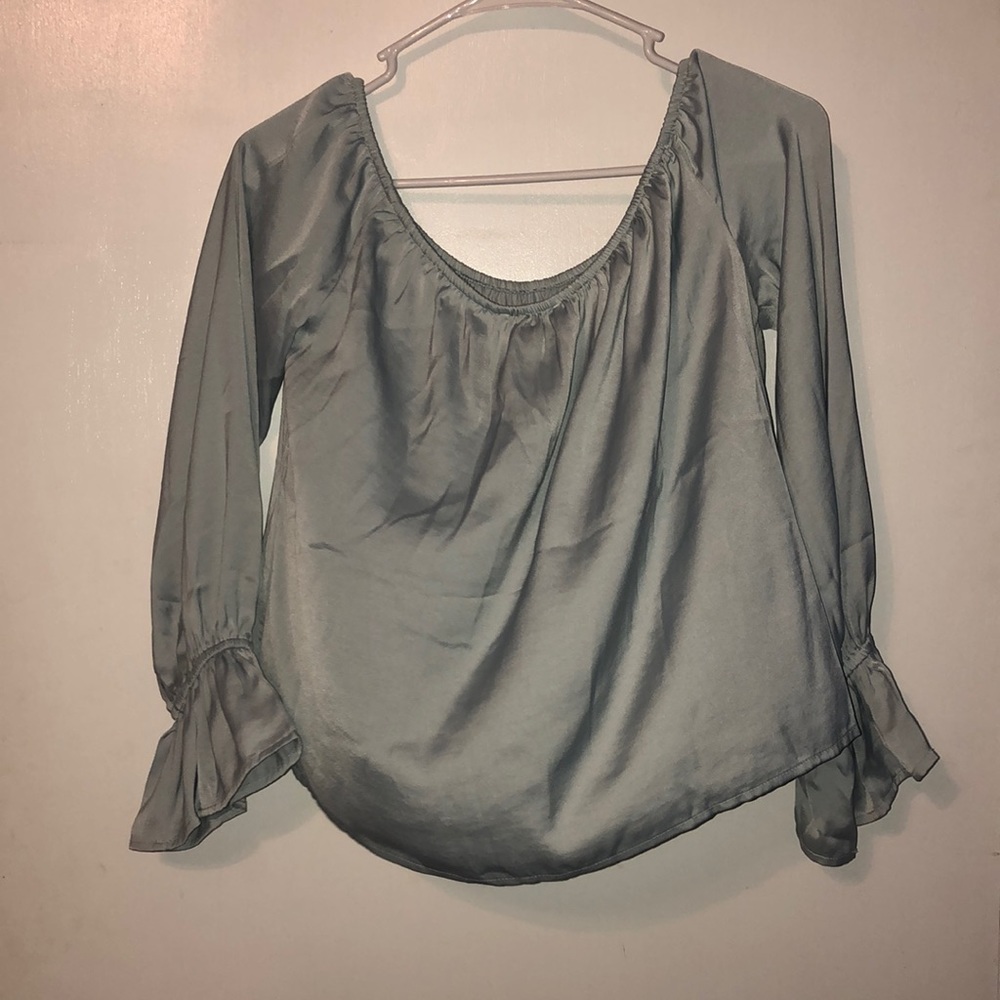 Baby blue satin off-the-shoulder top.